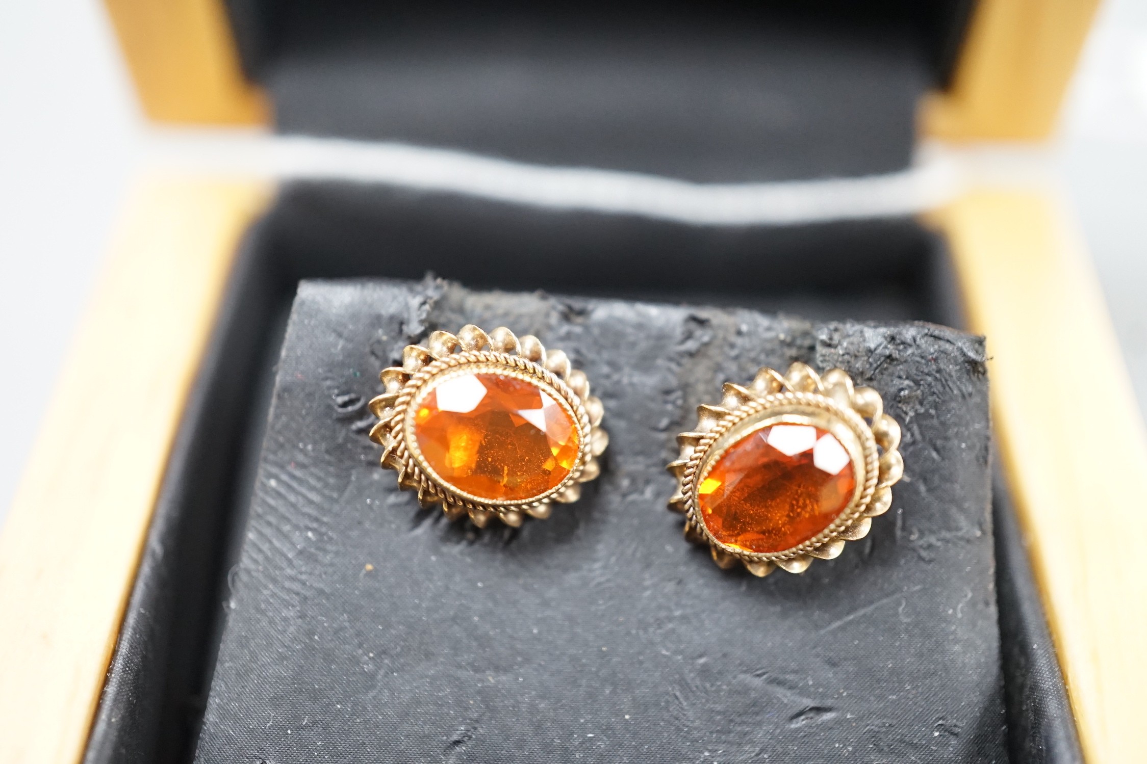A modern pair of 9ct gold and fire opal set oval earrings, 11mm, gross weight 1.8 grams.